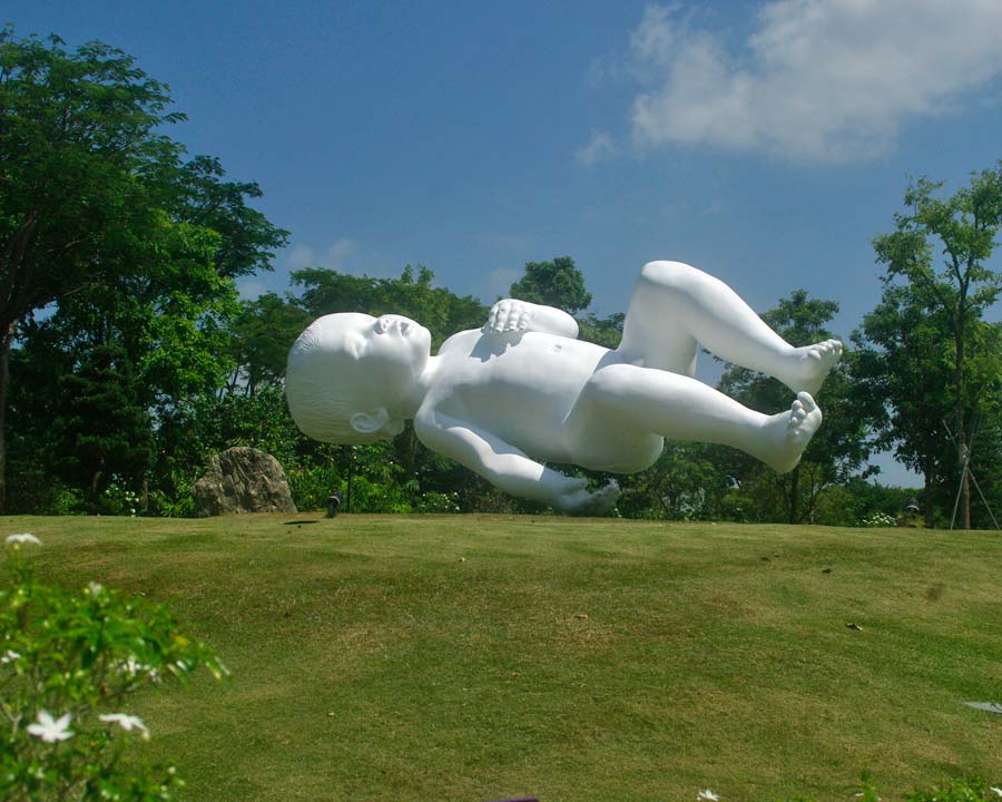 Gardens by the Bay - Singapore. Sculpture - Floating Baby 'the Planet' by Marc Quinn